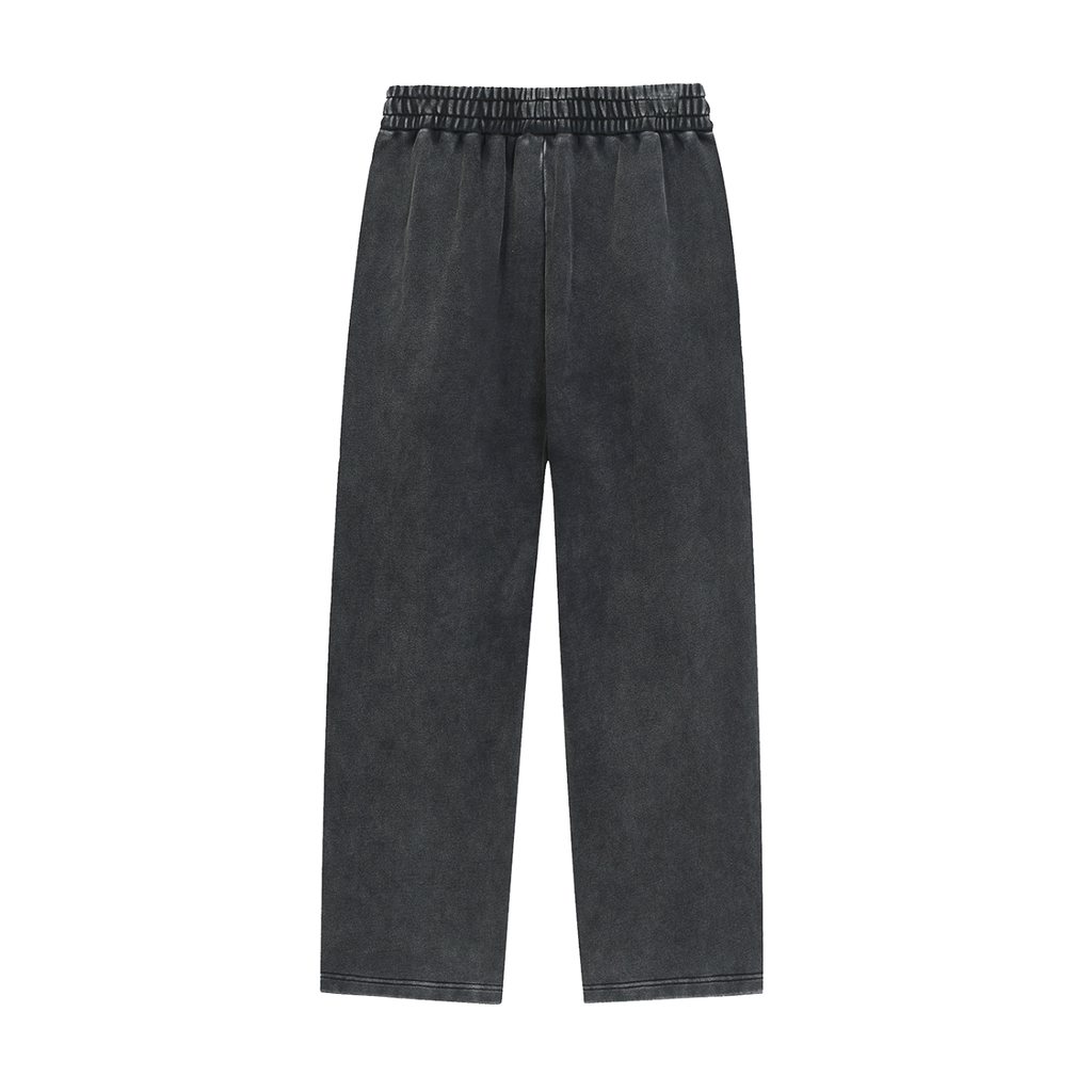 The Nashville Sweatpants are loose-fitting, unisex charcoal gray cotton pants with an elastic waistband and straight legs, ideal for relaxed streetwear style. Shown against a plain white background.