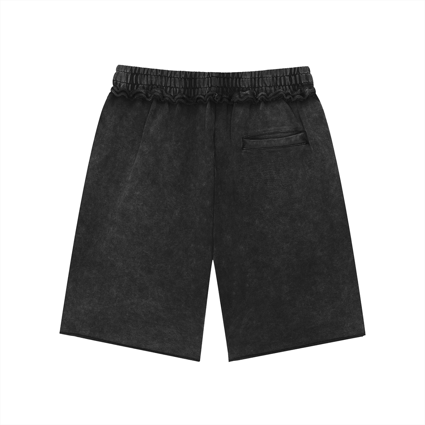 The Pensacola Shorts are black, knee-length unisex cotton shorts with a loose mid waist, subtle washed texture, elastic waistband, and single back pocket, shown on a white background.