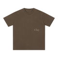 The Charleston Shirt is a loose fit unisex brown cotton t-shirt with "Clay" printed in small, light text on the left chest. This short sleeve tee is shown on a white background.