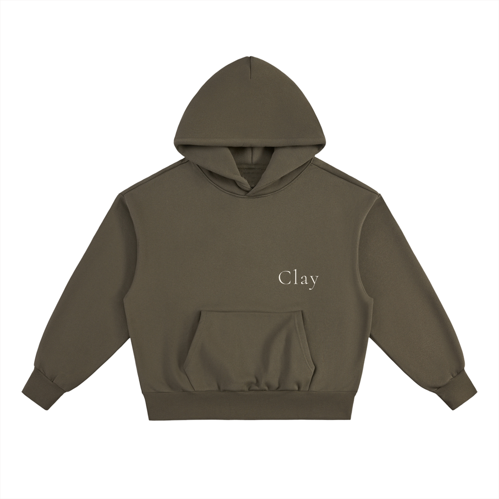 The Selma Hoodie is a unisex olive green hoodie made from a soft cotton blend, featuring "Clay" in white on the left chest and a front pocket, displayed on a white background.