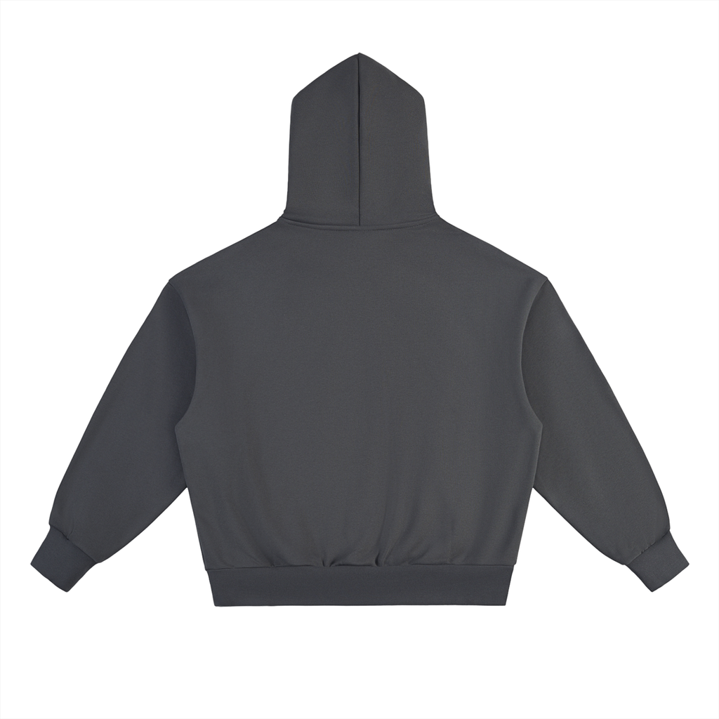 The Selma Hoodie, an oversized unisex design in plain dark gray cotton blend, is laid flat with the back facing up. It features long sleeves, ribbed cuffs, and a ribbed waistband.