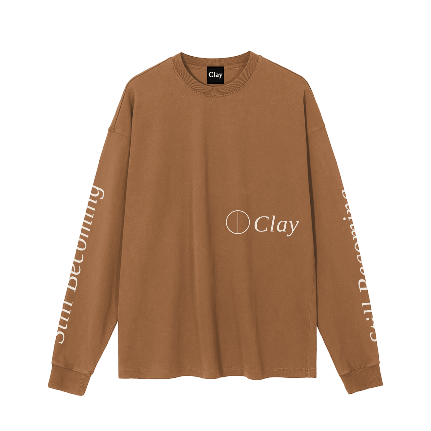 The Gatlinburg Long Sleeve T-Shirt is a brown unisex street casual shirt with "Clay" and a circle logo on the left chest, plus white "Still Becoming" text running vertically down the sleeves. Made from cotton for comfort and style.