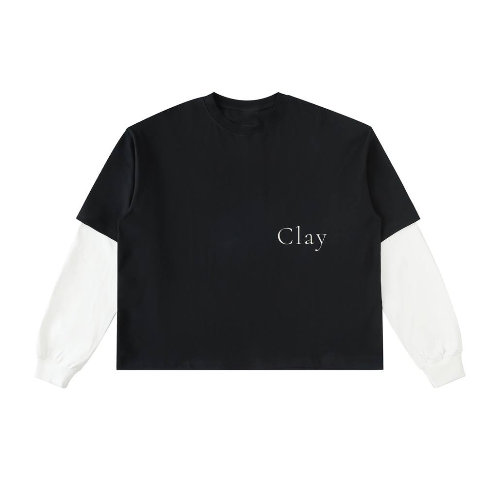 The Montgomery Shirt features black fabric with contrasting white long sleeves and "Clay" printed in small white letters on the left chest—ideal for casual streetwear.