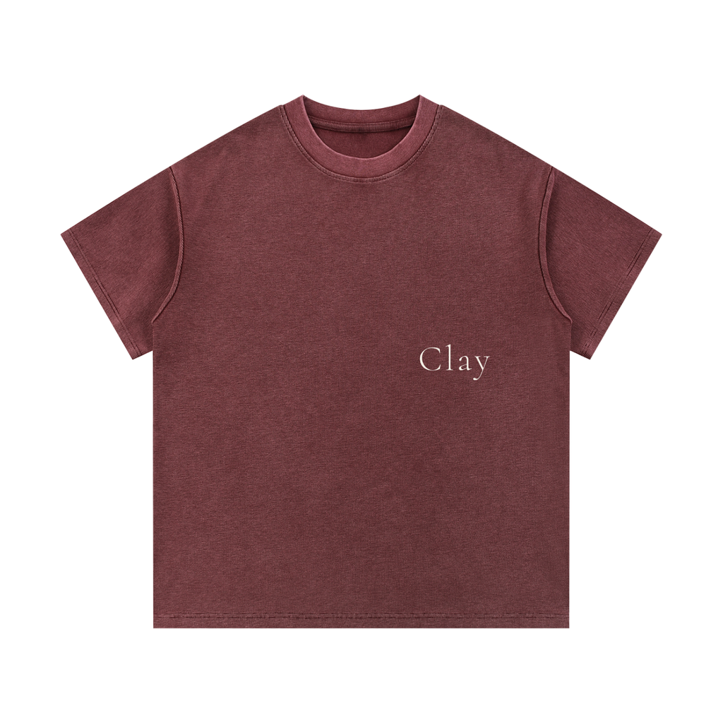 The Greenville Waffle Shirt is a maroon, loose-fit unisex summer tee with "Clay" in small white letters on the left chest—made from a comfortable cotton blend and perfect for casual streetwear.