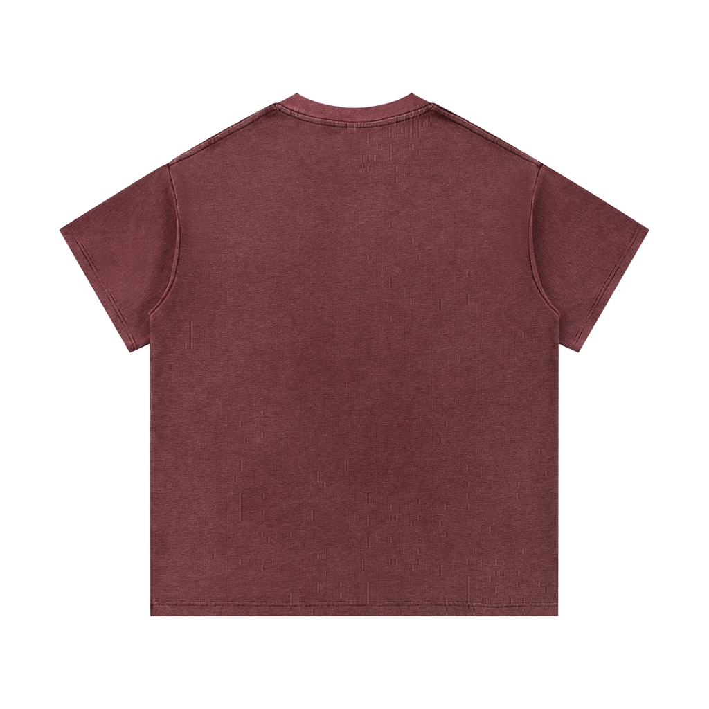 The Greenville Waffle Shirt, a plain maroon unisex cotton blend tee with short sleeves, is displayed flat with its back facing up on a white background.