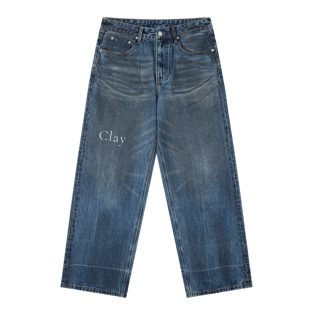The Birmingham Vintage Baggy Jeans are wide-leg, high-waisted blue jeans with a faded wash and "Clay" printed on the left thigh—perfect men's cotton blend pants for a cool streetwear trousers vibe.